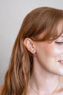 model wears Sapphire Cubic Zirconia Gold Labret Earring