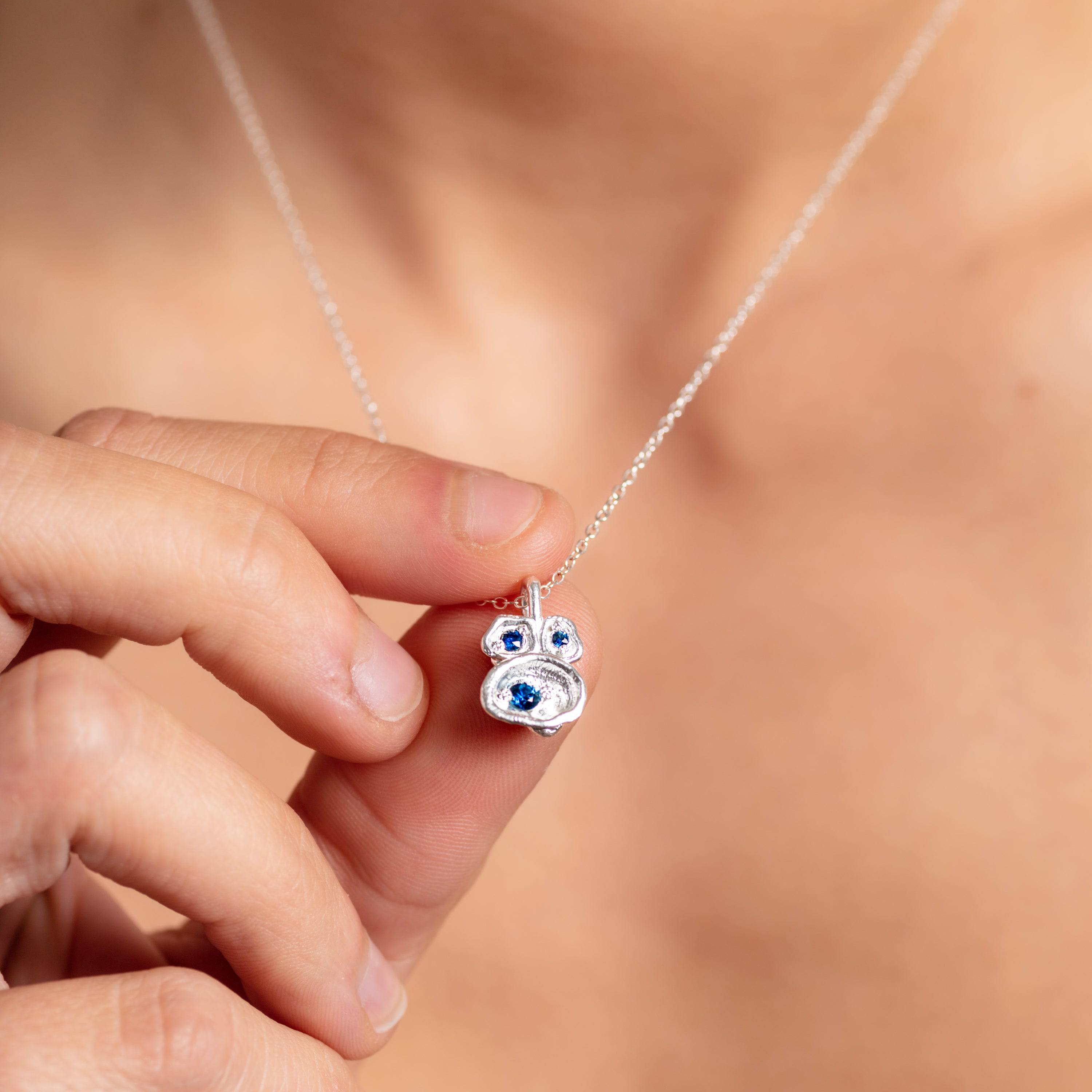 model wears Blue Sapphire and Silver Lichen Birthstone Pendant Necklace - close up