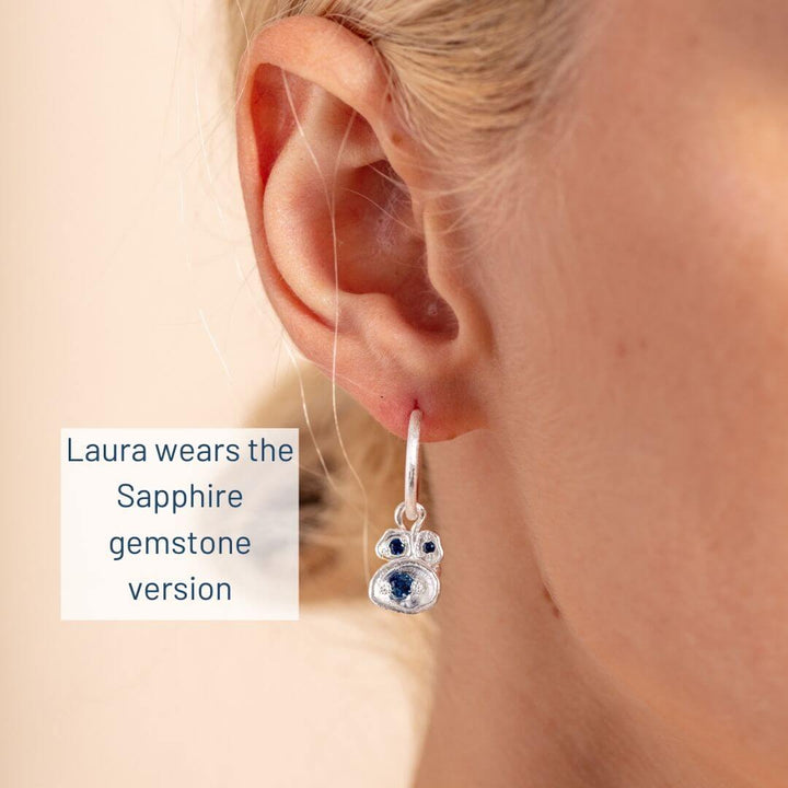 model wears sapphre silver birthstone hoop earrings 