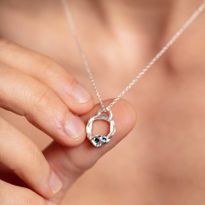 Model wears Blue Sapphire and Silver Branch Eternity Birthstone Necklace (Small)