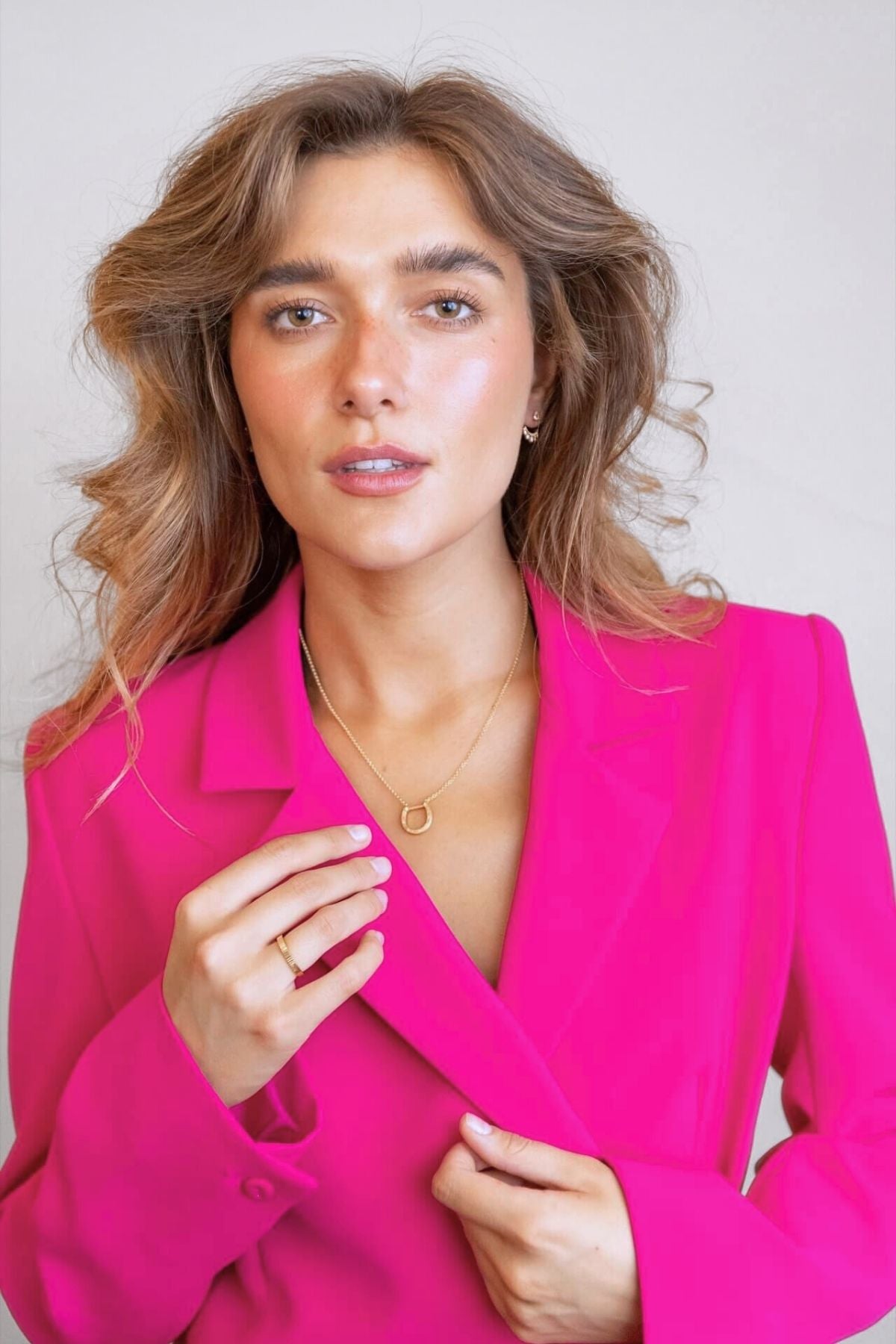model wears sparkly crescent moon gold ear jacket earrings  and shorthand horseshoe necklace
