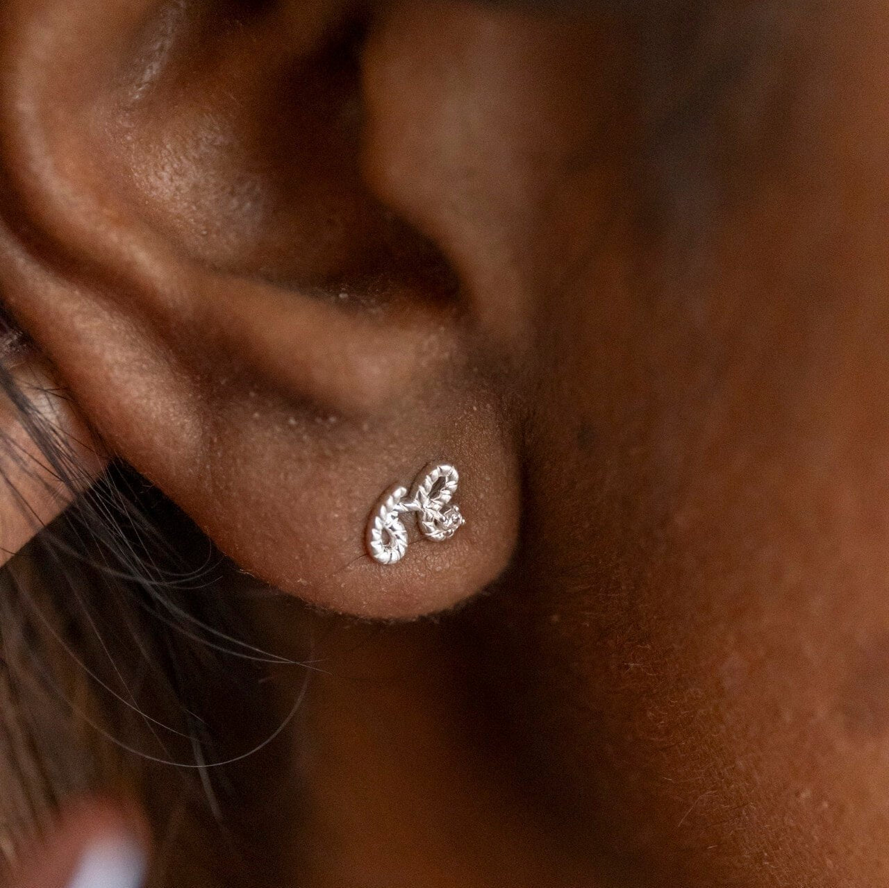 Model wears Beautiful Silver Shorthand Stud Earring - Claire Hill Designs 
