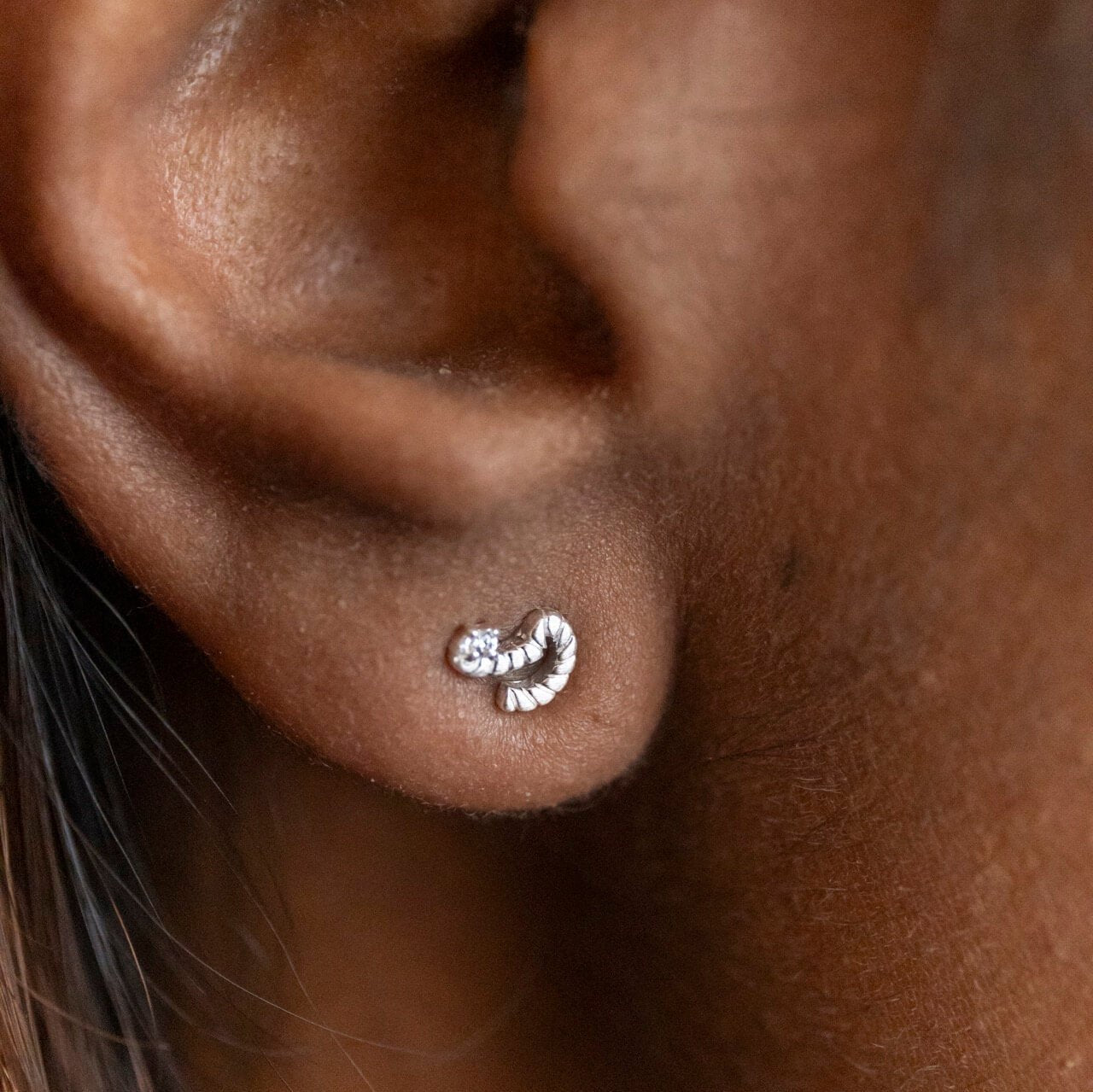 model wears Silver Shorthand Stud Earring meaning Courage - Claire Hill Designs 