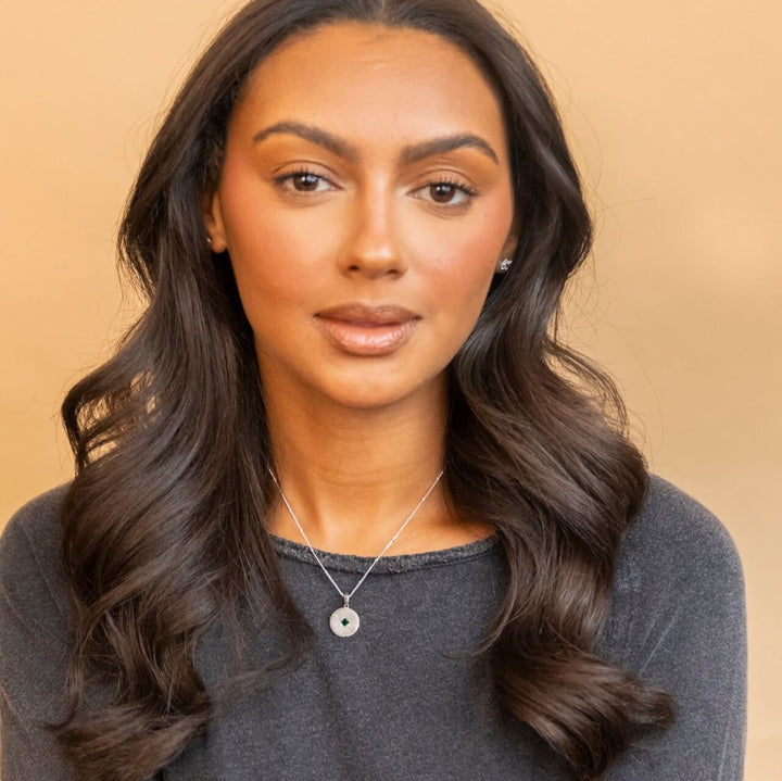 model wears silver Lovespoon charm disc pendant necklace - Claire Hill Designs 