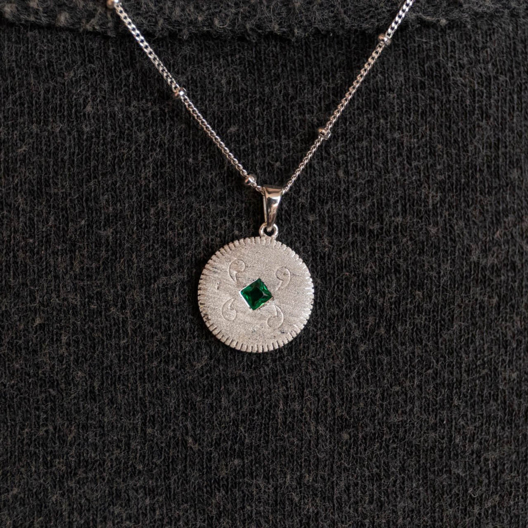 model wears silver Lovespoon charm disc pendant necklace on satellite chain  - Claire Hill Designs 