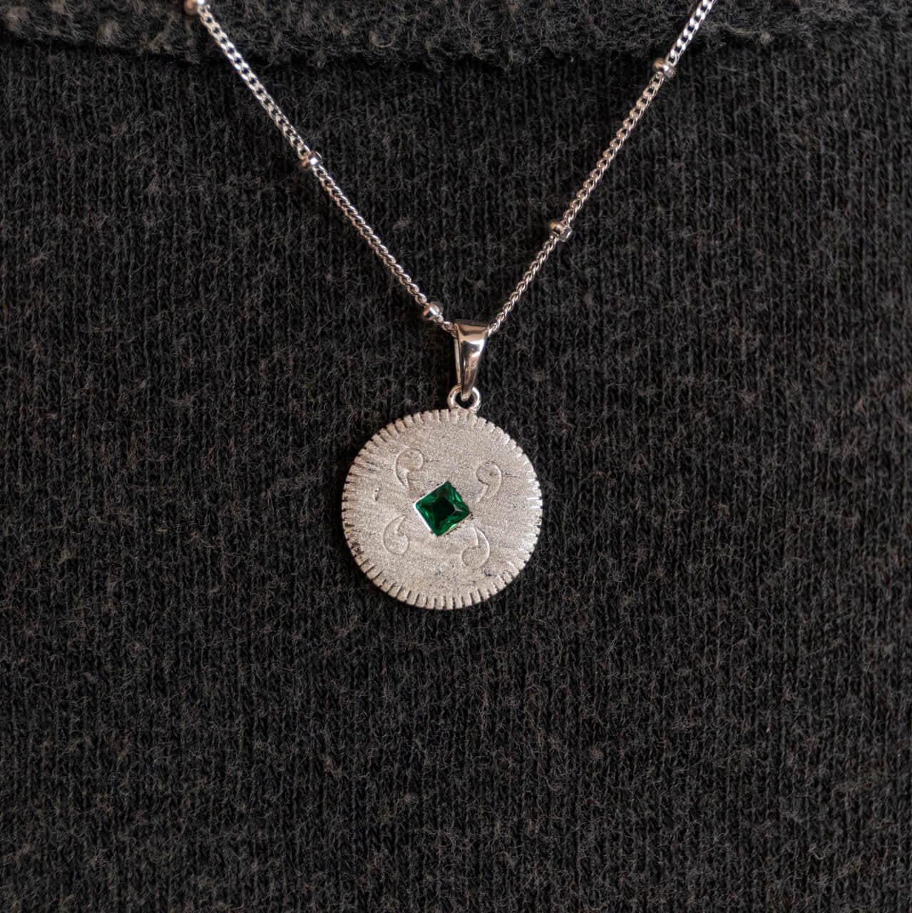 model wears Lovespoon silver disc charm pendant - Claire Hill Designs