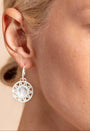 model wears Geometric Mother of Pearl and Silver Statement Hoop Earrings close up
