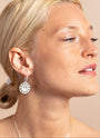 model wears Geometric Mother of Pearl and Silver Statement Hoop Earrings