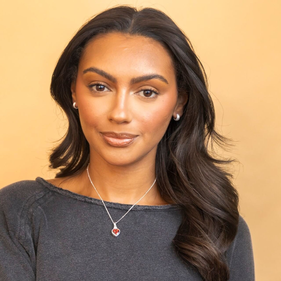 model wears chunky silver huggie hoop earrings