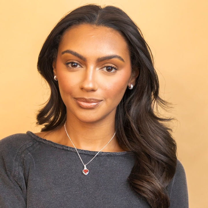 model wears chunky silver huggie hoop earrings