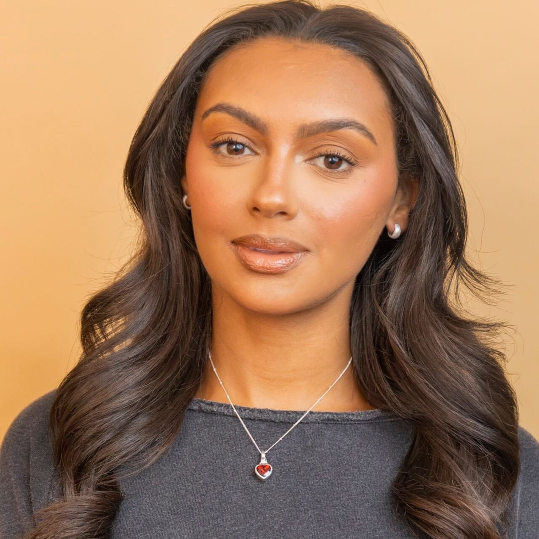 model wears Silver Hand In Heart Charm Pendant necklace- Claire Hill Designs