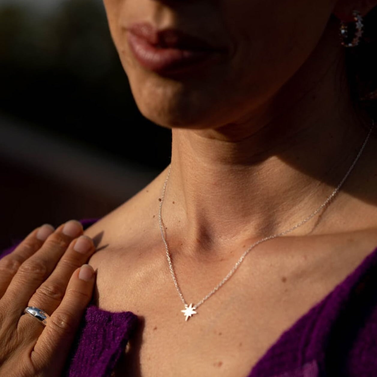 model wears silver brushed north star dainty necklace 