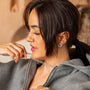 model wears silver rolo belcher chain necklace, silver chunky figaro necklace and emerald gemstone and silver statement stud earrings
