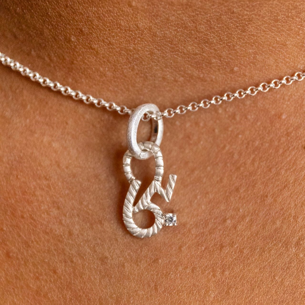 model wears Brave Silver Shorthand Charm Pendant - Claire Hill Designs