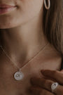 model wears “Fuck” Silver Shorthand Coin Necklace and "Fuck" silver shorthand signet ring