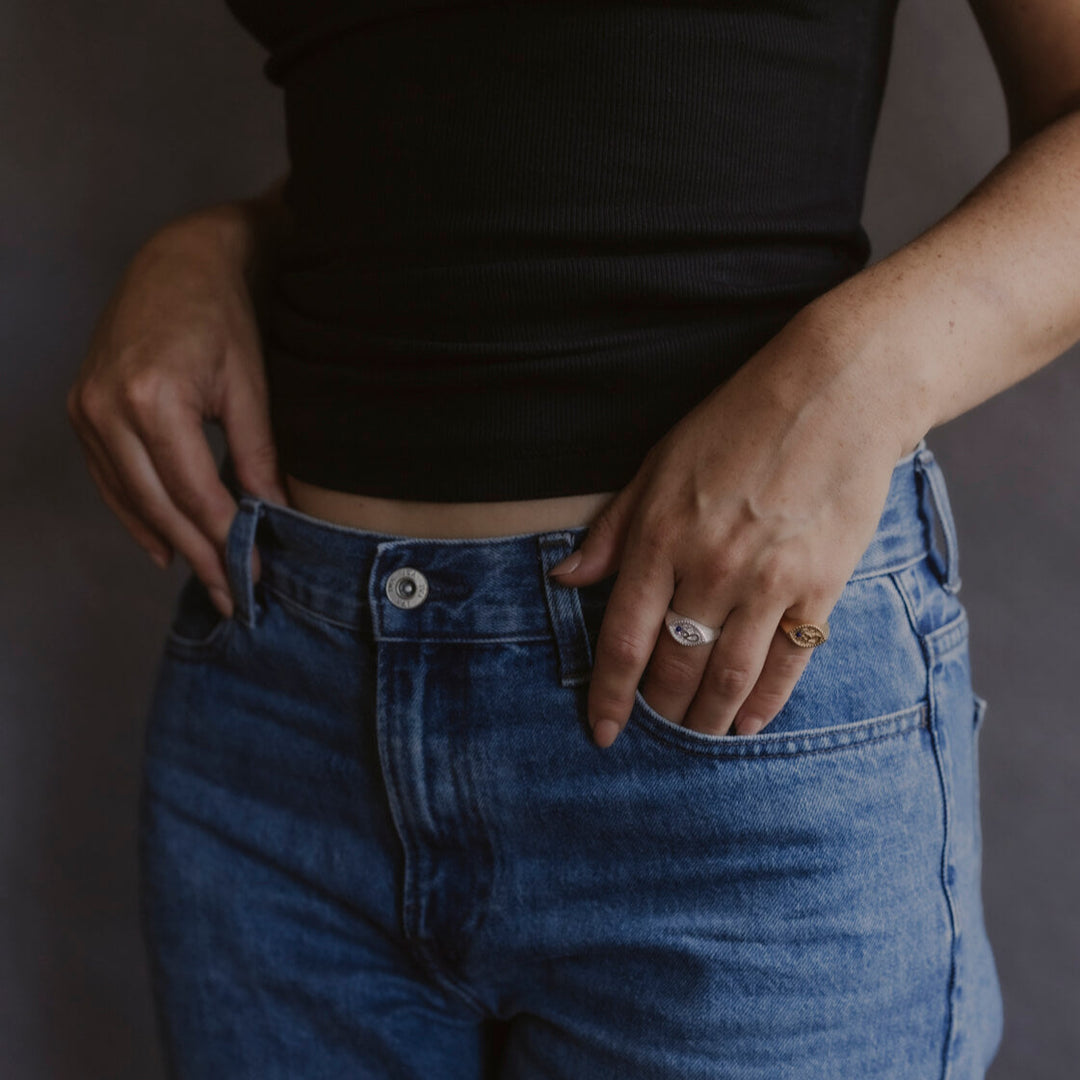 model wears Fuck Silver Shorthand Signet Ring