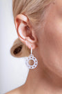 model wears Geometric Statement Silver Hoop Earrings