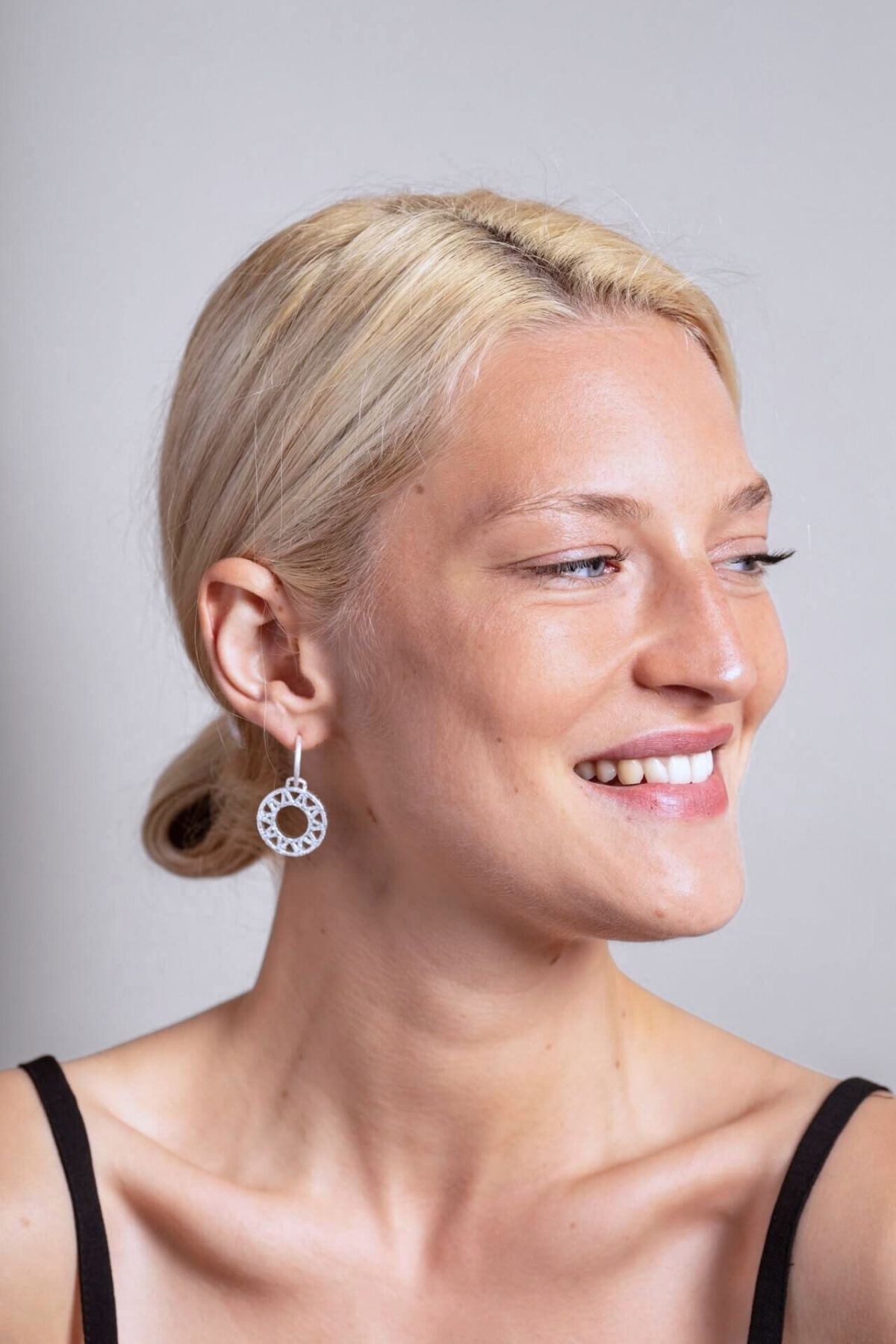 model wears Geometric Statement Silver Hoop Earrings