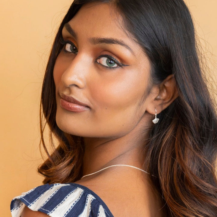 model wears Ginkgo Leaf Silver Earrings
