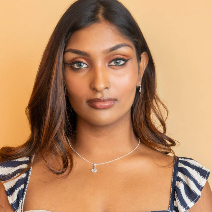 model wears Ginkgo Leaf Silver Charm Pendant
