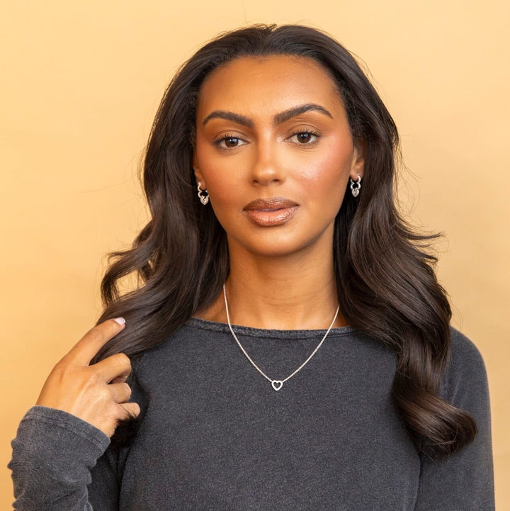 model wears Silver Sparkly Cloud Hoop Earrings and Silver Heart Charm Necklace - Claire Hill Designs