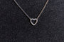 model wears silver heart connector necklace