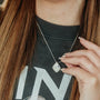 model-wears-silver-lapis-lazuli-art-deco-pendant-necklace-claire-hill-designs