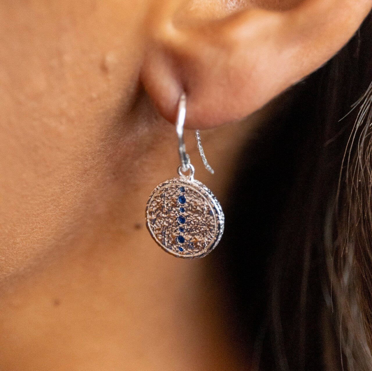 model wears Sapphire Silver Coin Pendant Earrings