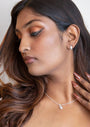 model wears Brushed Silver Chunky Huggie Hoops