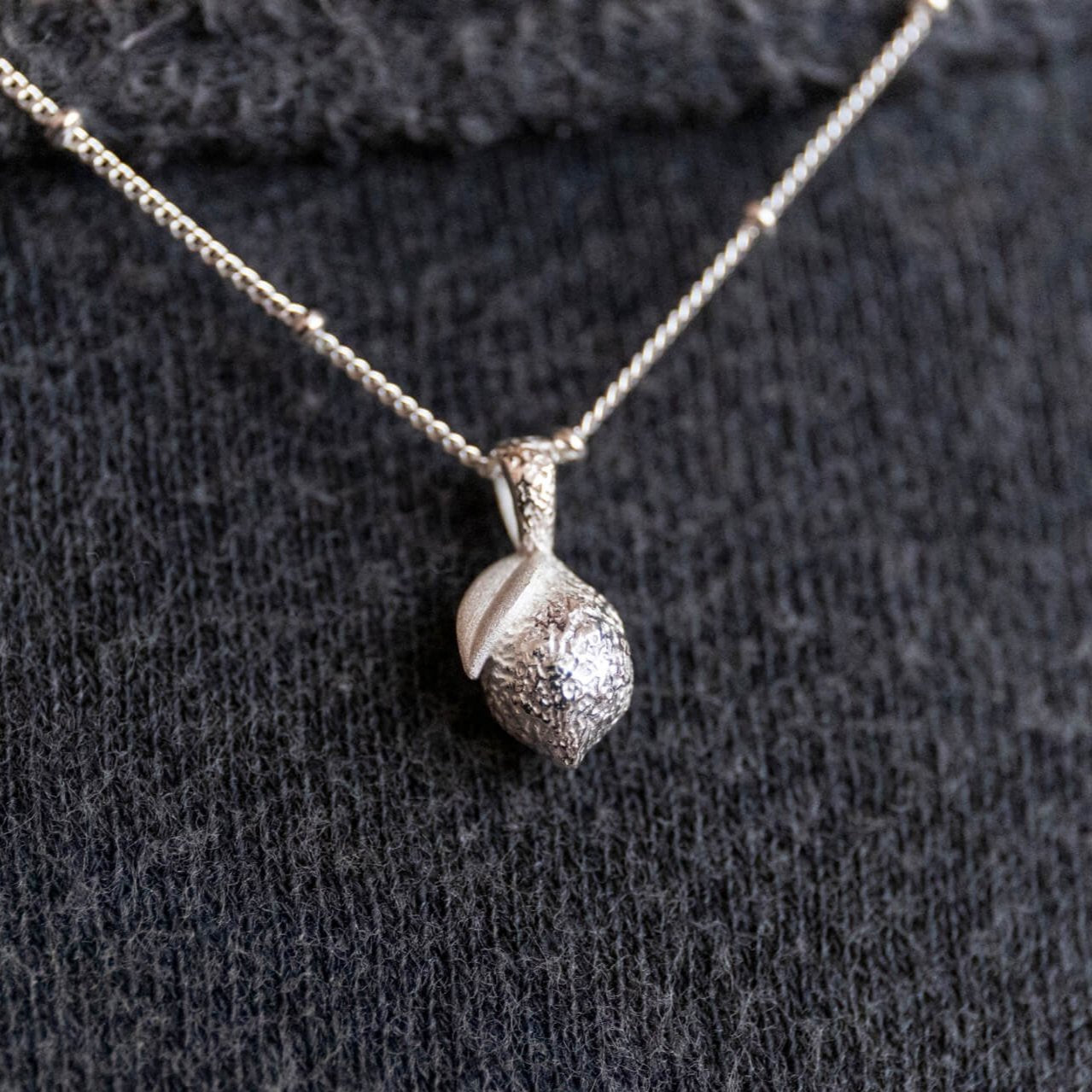 model wears silver Lemon Charm Necklace - Claire Hill Designs