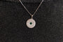model wears Lovespoon Silver Charm Pendant necklace - close up
