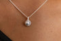 model wears silver moon charm necklace - close up