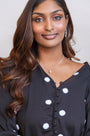 model wears silver moon charm necklace