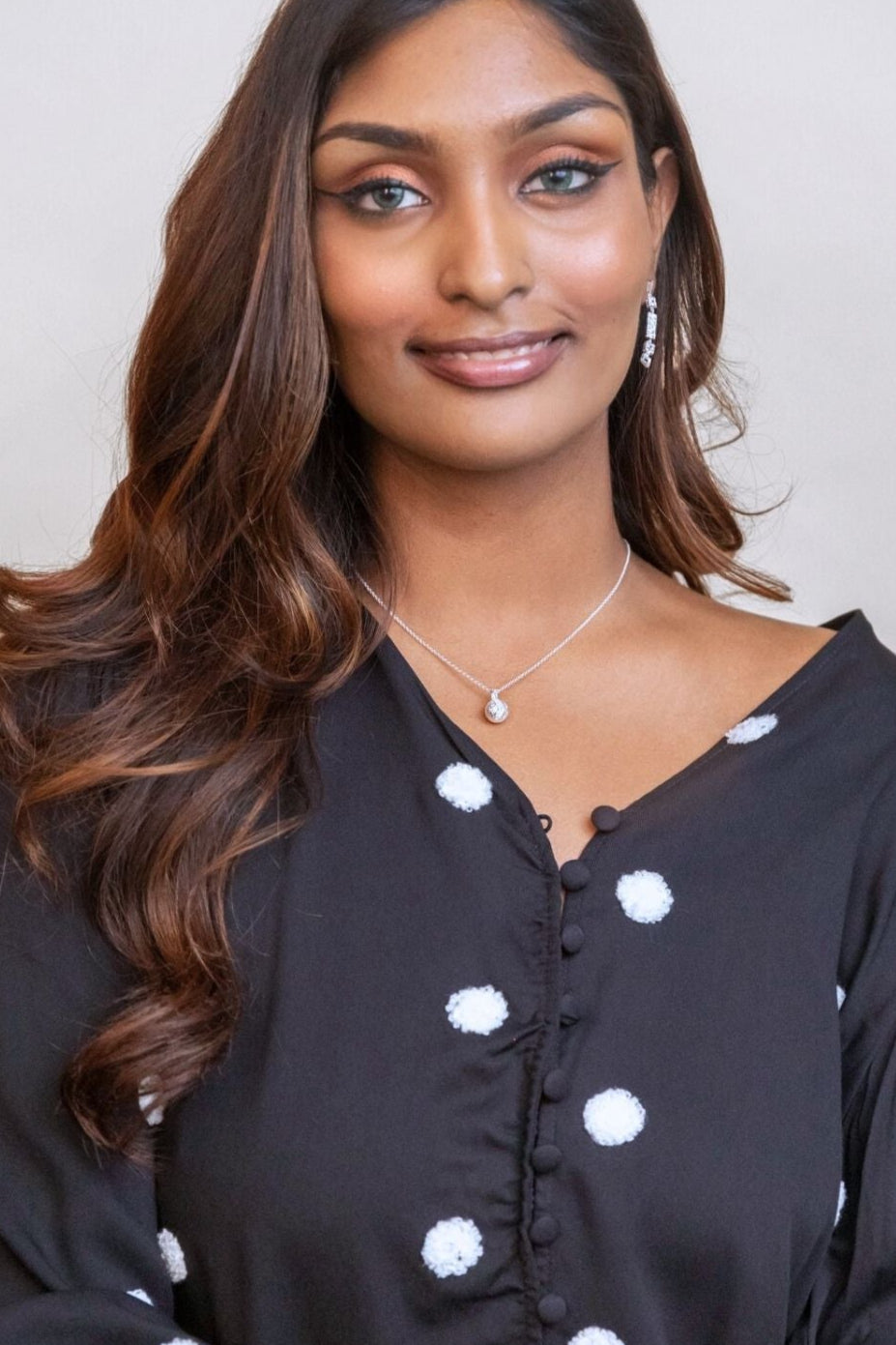 model wears silver moon charm necklace