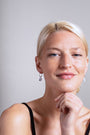model wears Sapphire Silver Lichen Hoop Earrings