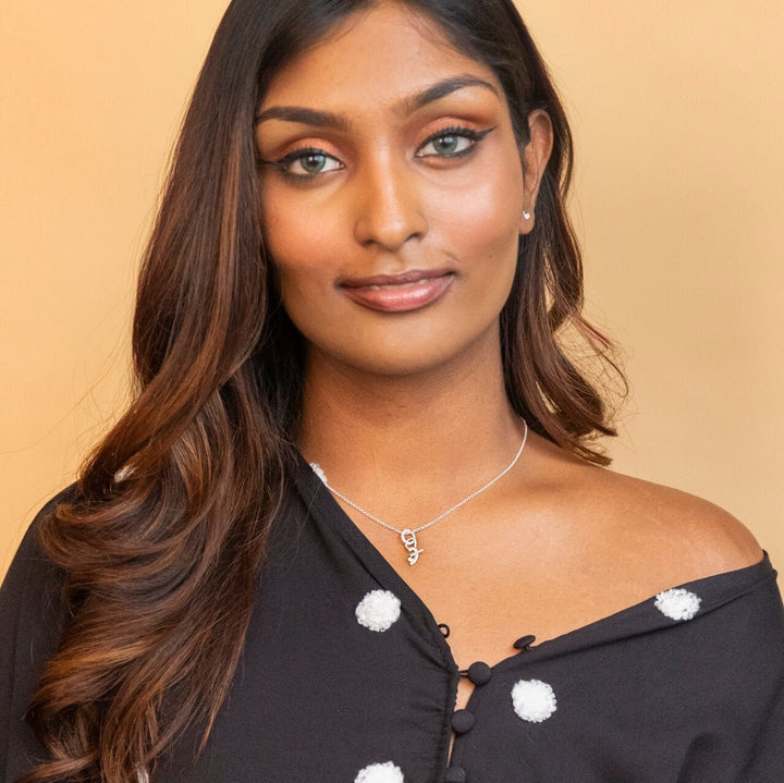 model wears Silver Shorthand Charm Necklace Meaning Great - Claire Hill Designs