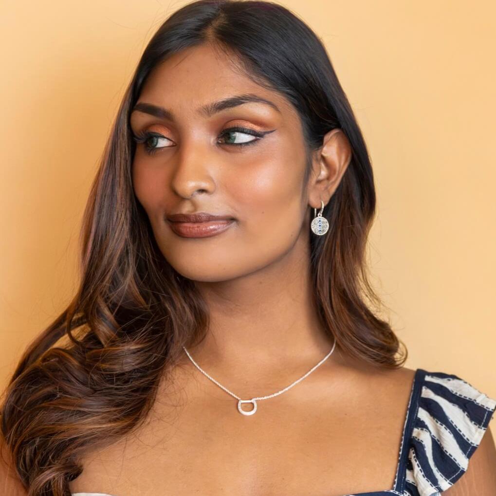 model wears Sapphire Silver Coin Pendant Earrings