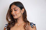 model wears Sparkly Silver Cloud Charm Necklace and silver cloud hoop earrings