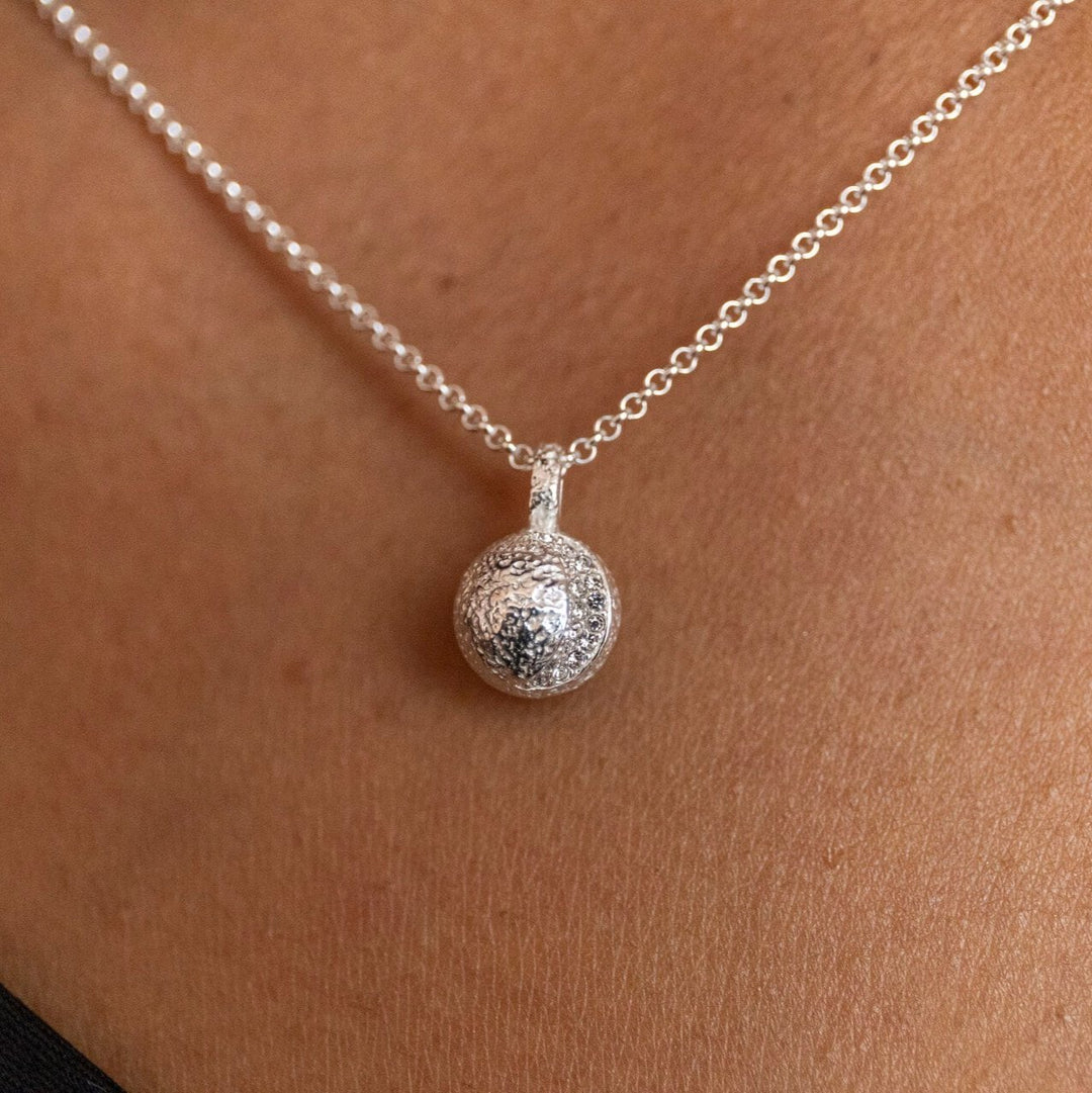 Model wears sparkly crescent silver moon Charm Necklace - Claire Hill Designs 