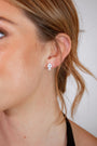 model wears White Topaz Silver Climber Stud Earrings