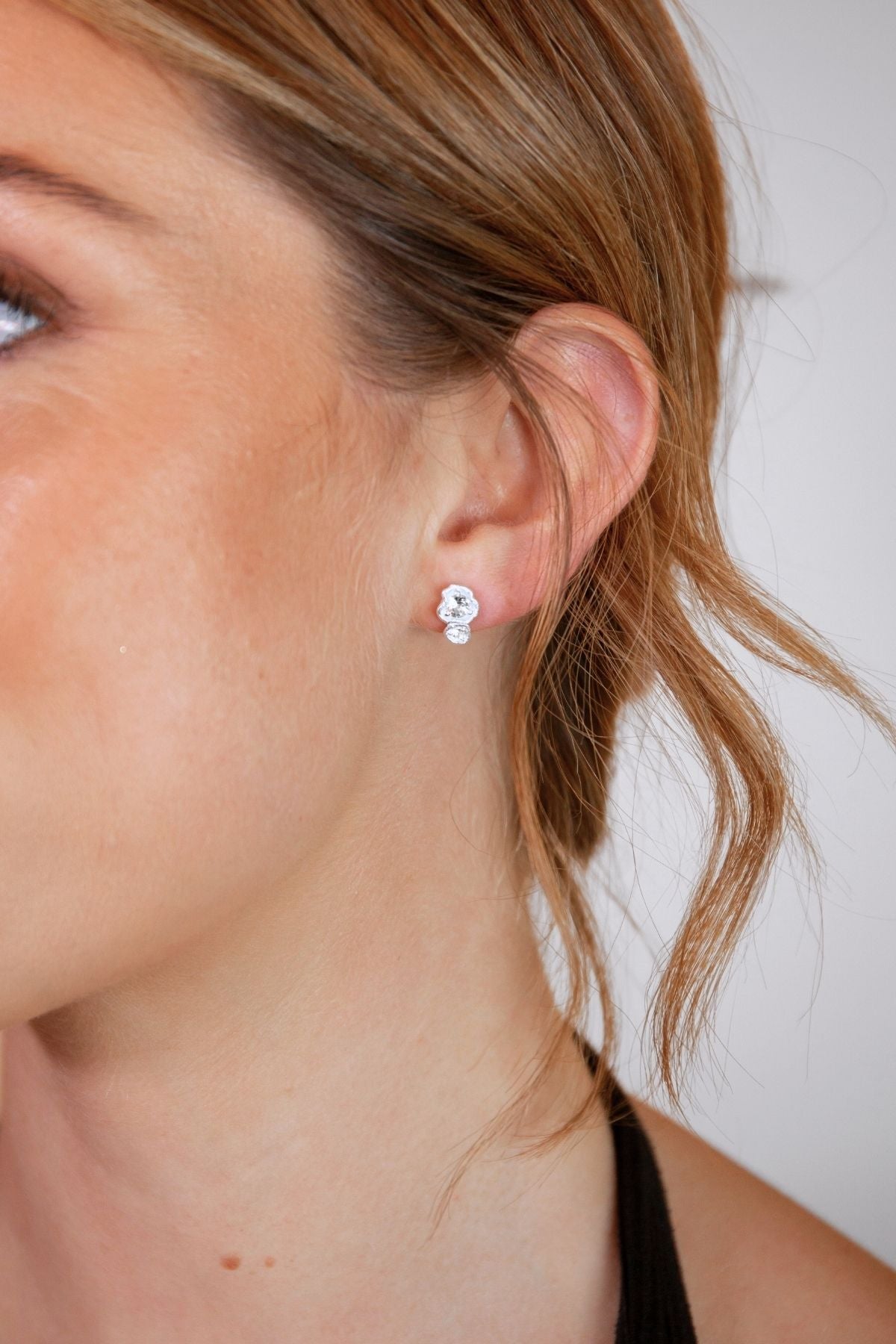 model wears White Topaz Silver Climber Stud Earrings