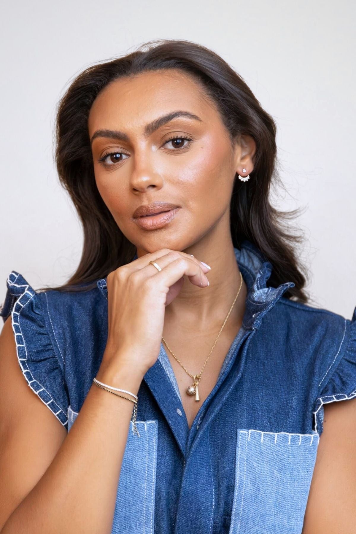 model wears sparkly crescent moon gold ear jacket earrings and heart connector necklace with moon and comet charm
