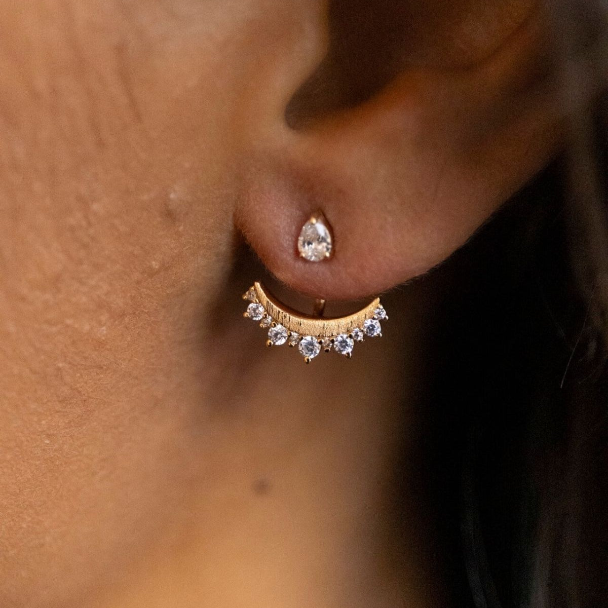 model wears sparkly crescent moon gold ear jacket earrings 