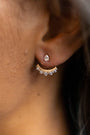 model wears sparkly crescent moon gold ear jacket earrings 