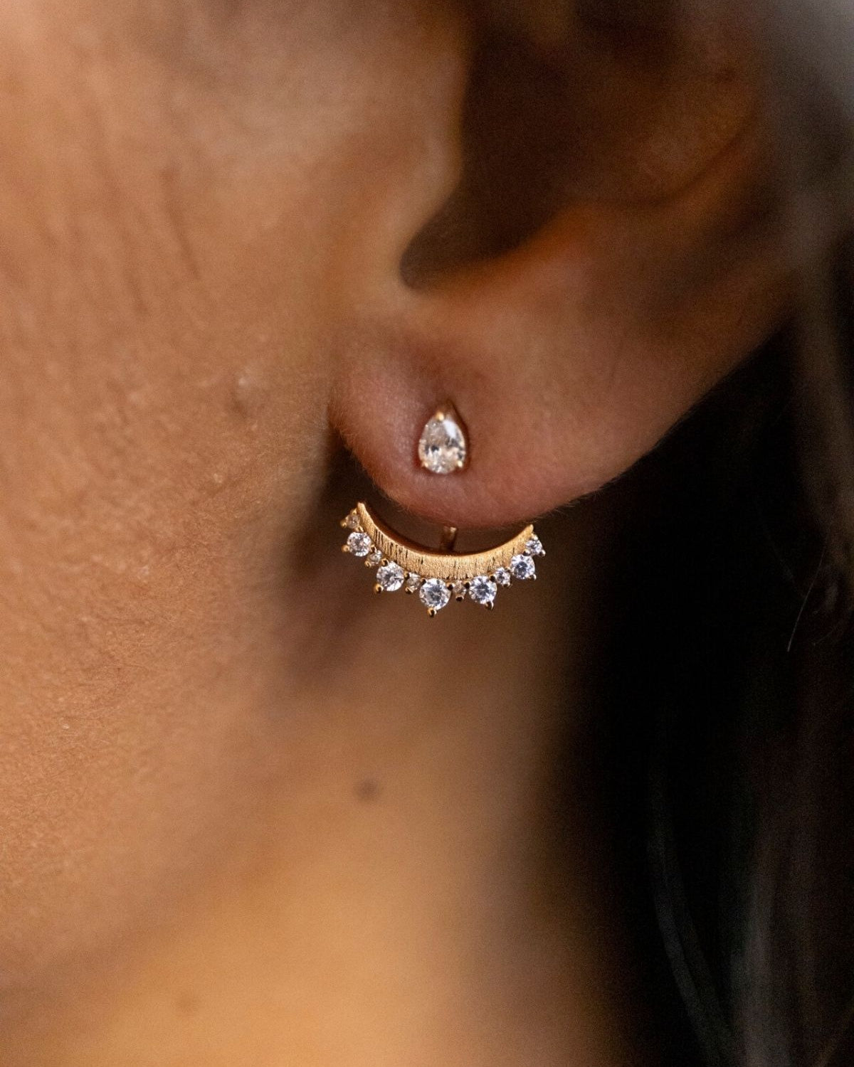 model wears sparkly crescent moon gold ear jacket earrings 