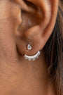 model wears sparkly crescent moon silver ear jacket earrings 