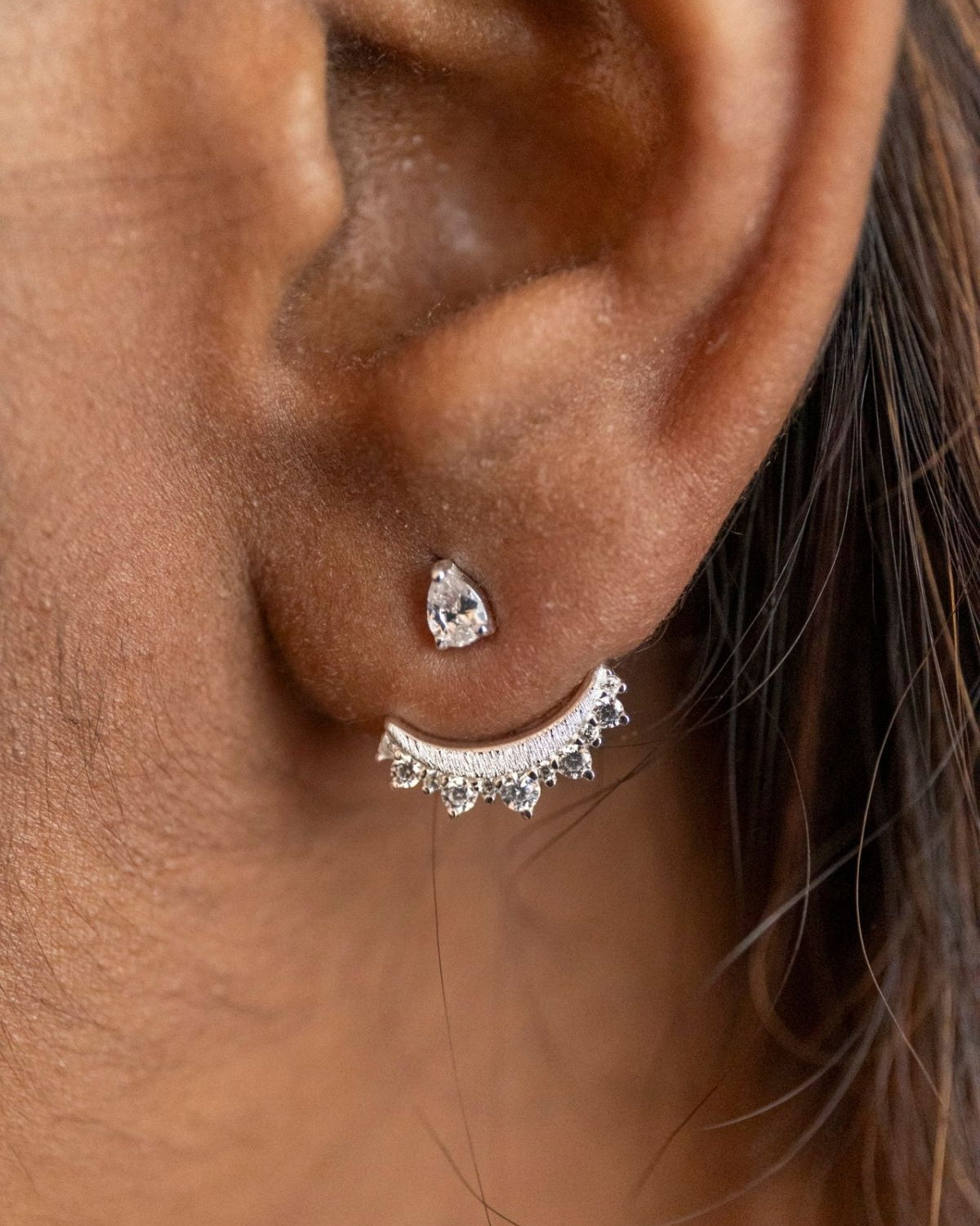 model wears sparkly crescent moon silver ear jacket earrings 