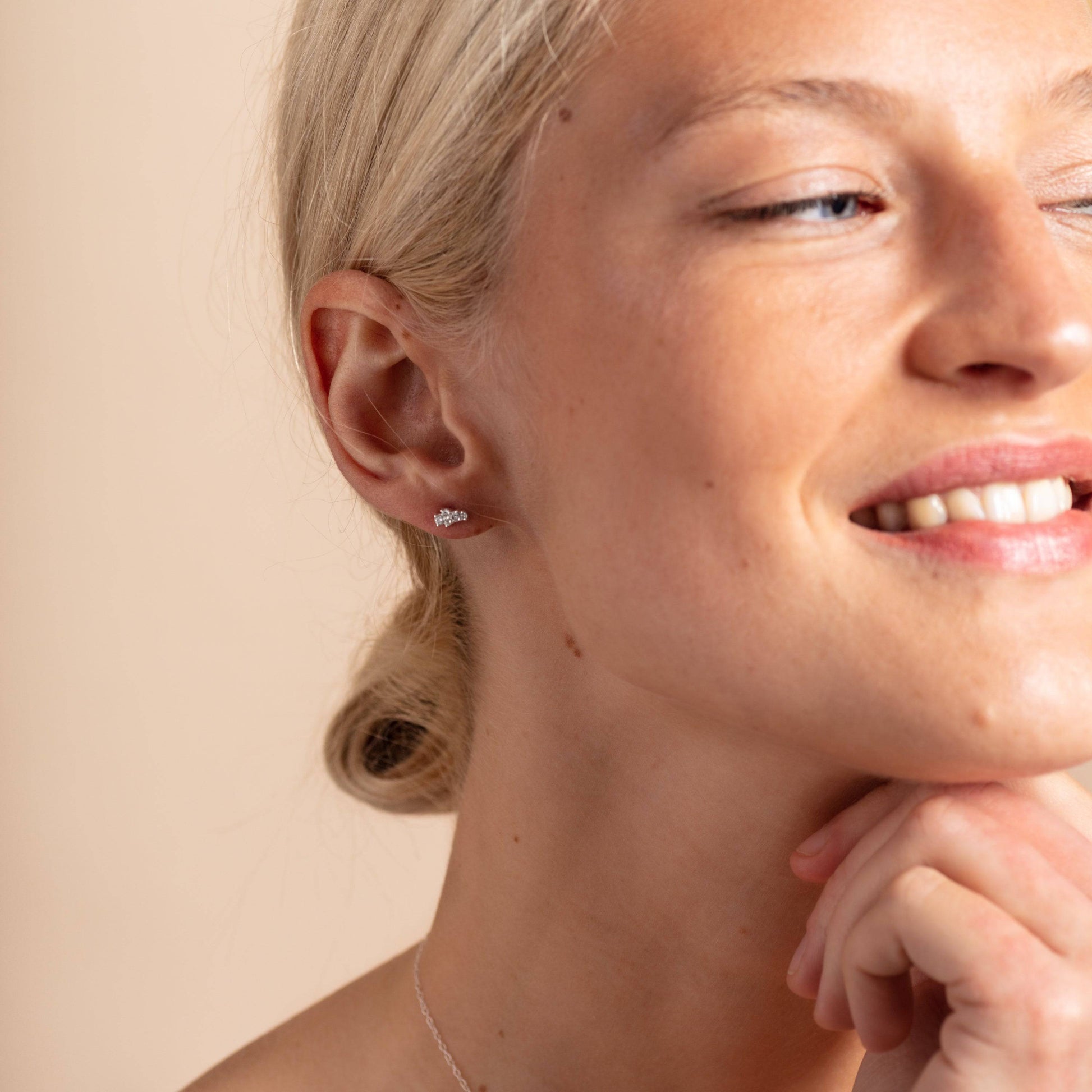 model wears Galaxy Sparkly Silver Stud Earrings