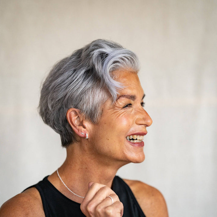 model wears Galaxy Sparkly Silver Scatter Huggie Earrings