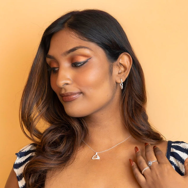 model wears Sparkly Silver Cloud Charm Pendant -  Claire Hill Designs